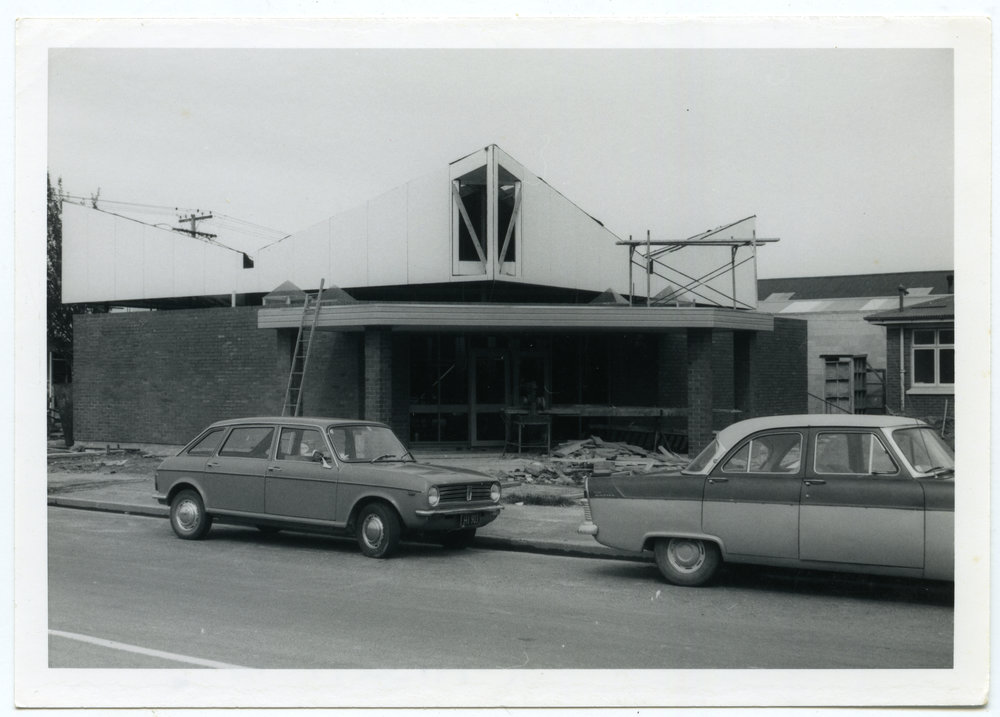 Two cars outside St. Andrew's Church in Balclutha