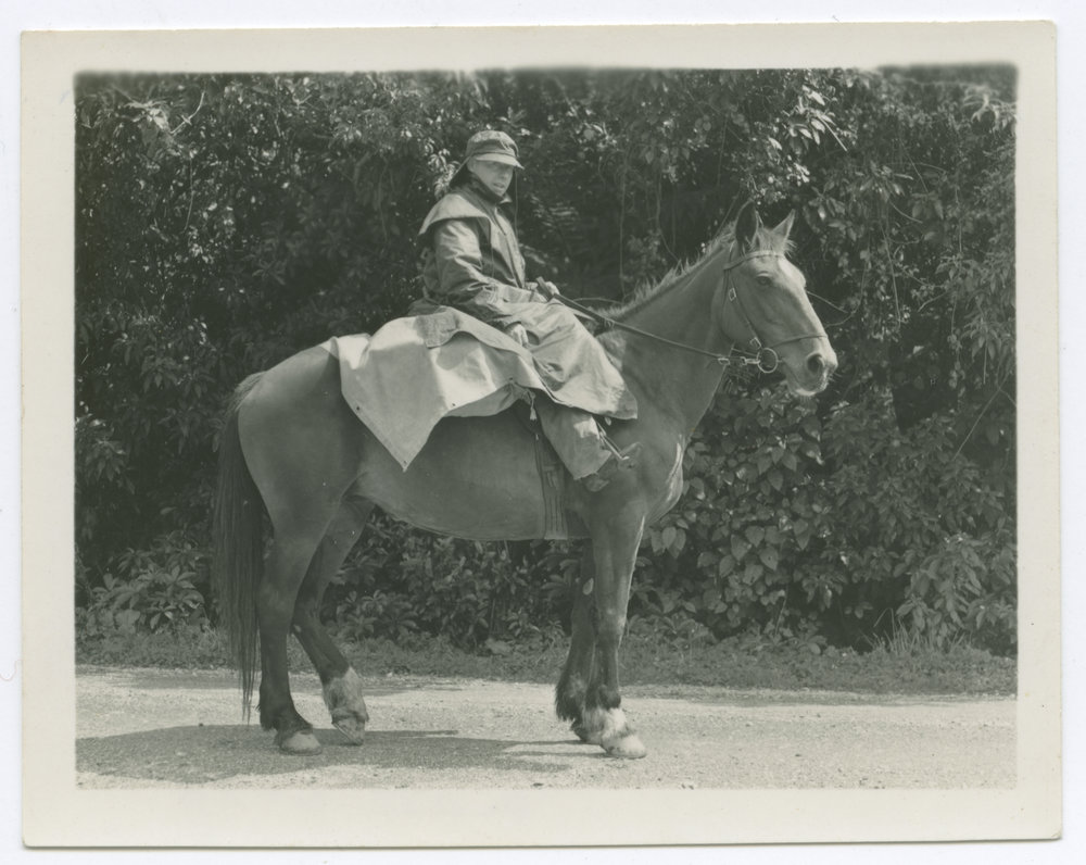 Unknown man, riding a horse