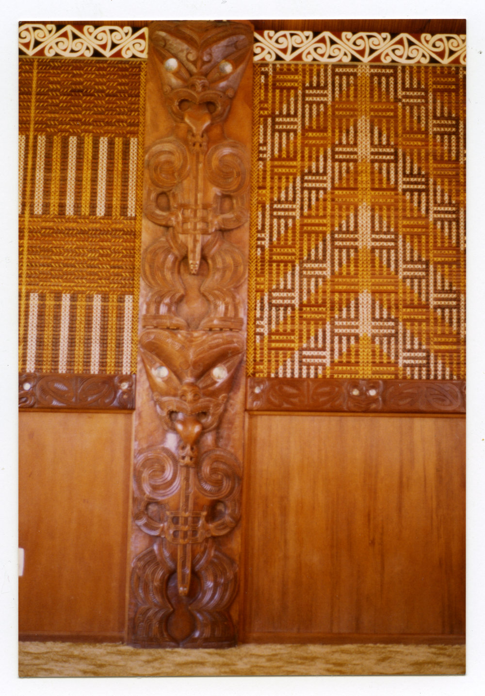 Carved post and tukutuku panels at Te Maungarongo