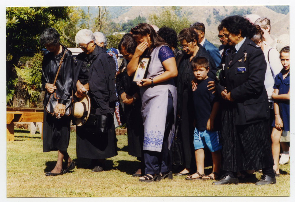 A group of people coming onto a marae [a tangi?]