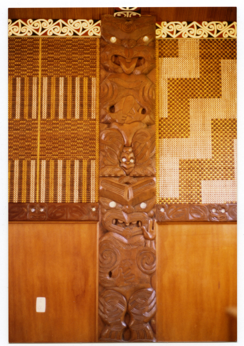 Carving and tukutuku panels inside Te Maungarongo
