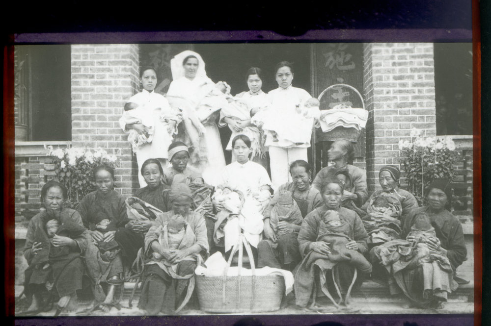 Nurses With Villagers And Babies