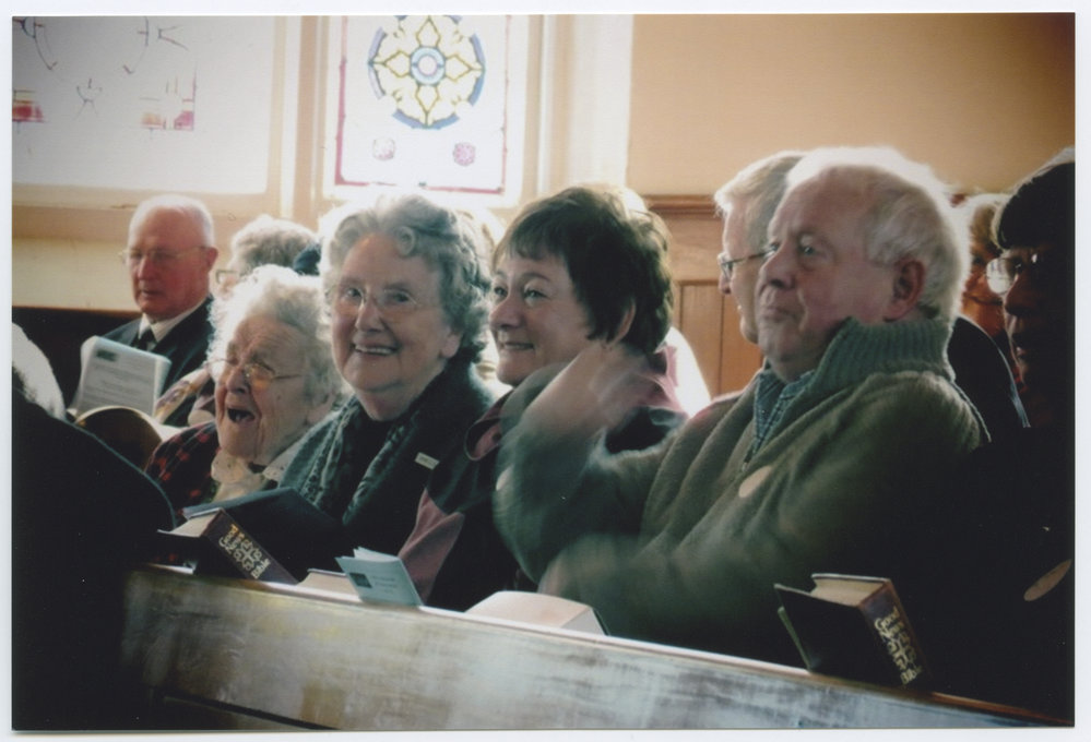 Sitting in the pews at the 150th Anniversary Service