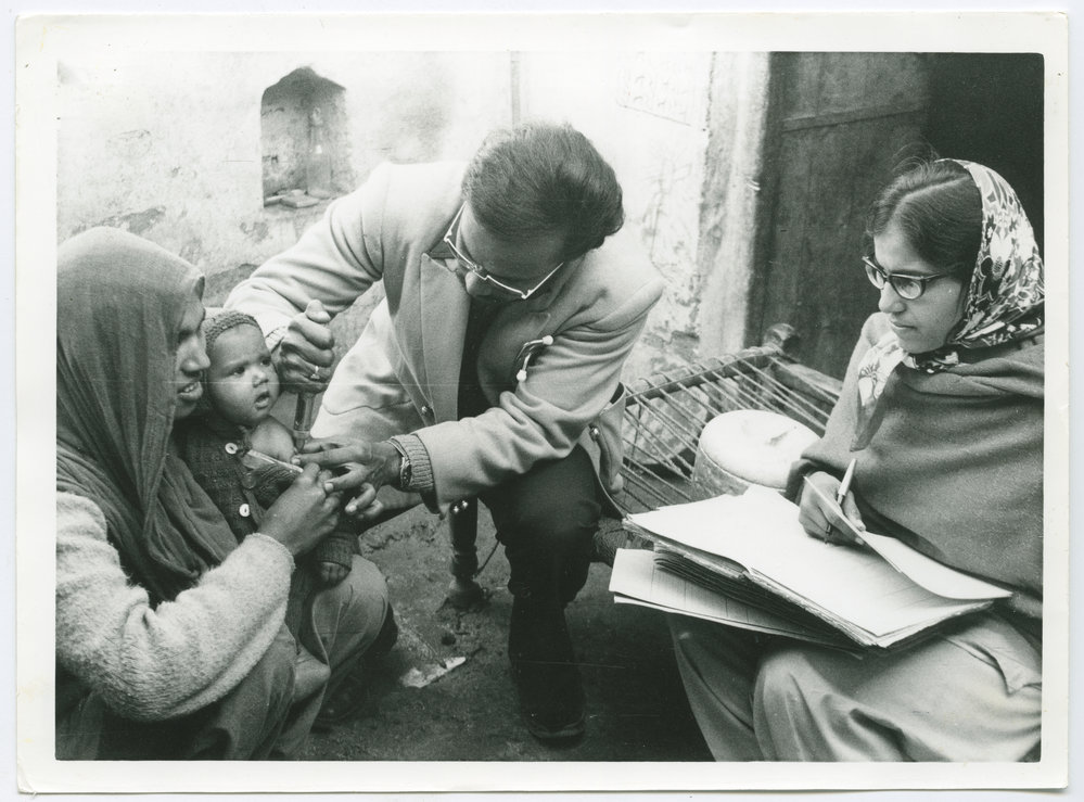 Dr Parmalingam treating a baby