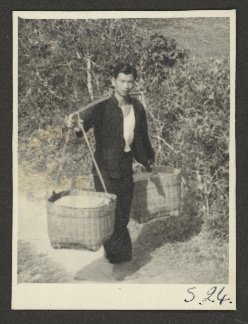 Man Carrying Baskets
