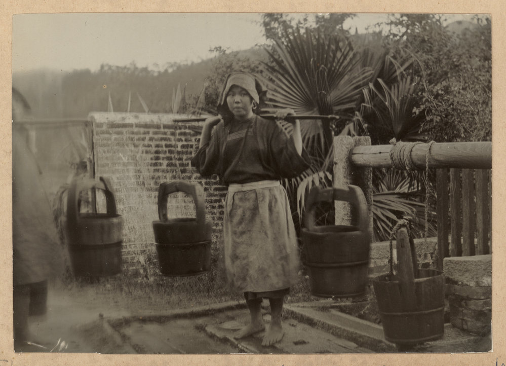 A Hakka Girl Carrying Water.