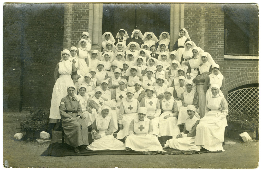 Group of 67 nurses sitting on steps 