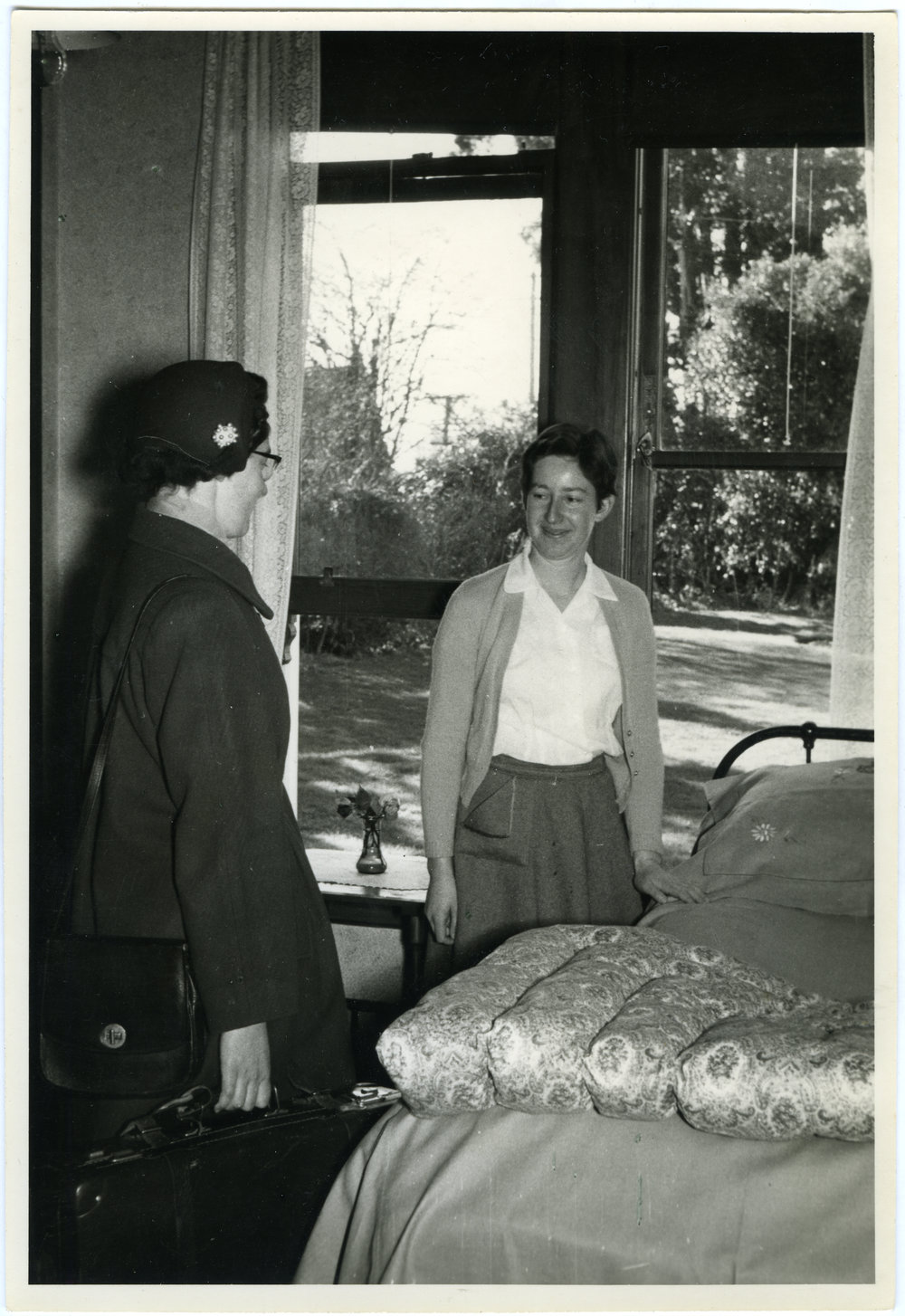 Doreen M. Riddell and unknown student in a Deaconess College bedroom