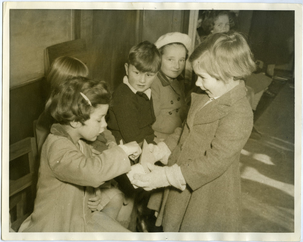 Young girl collecting offering at primary Sunday School, St. Alban's, Christchurch