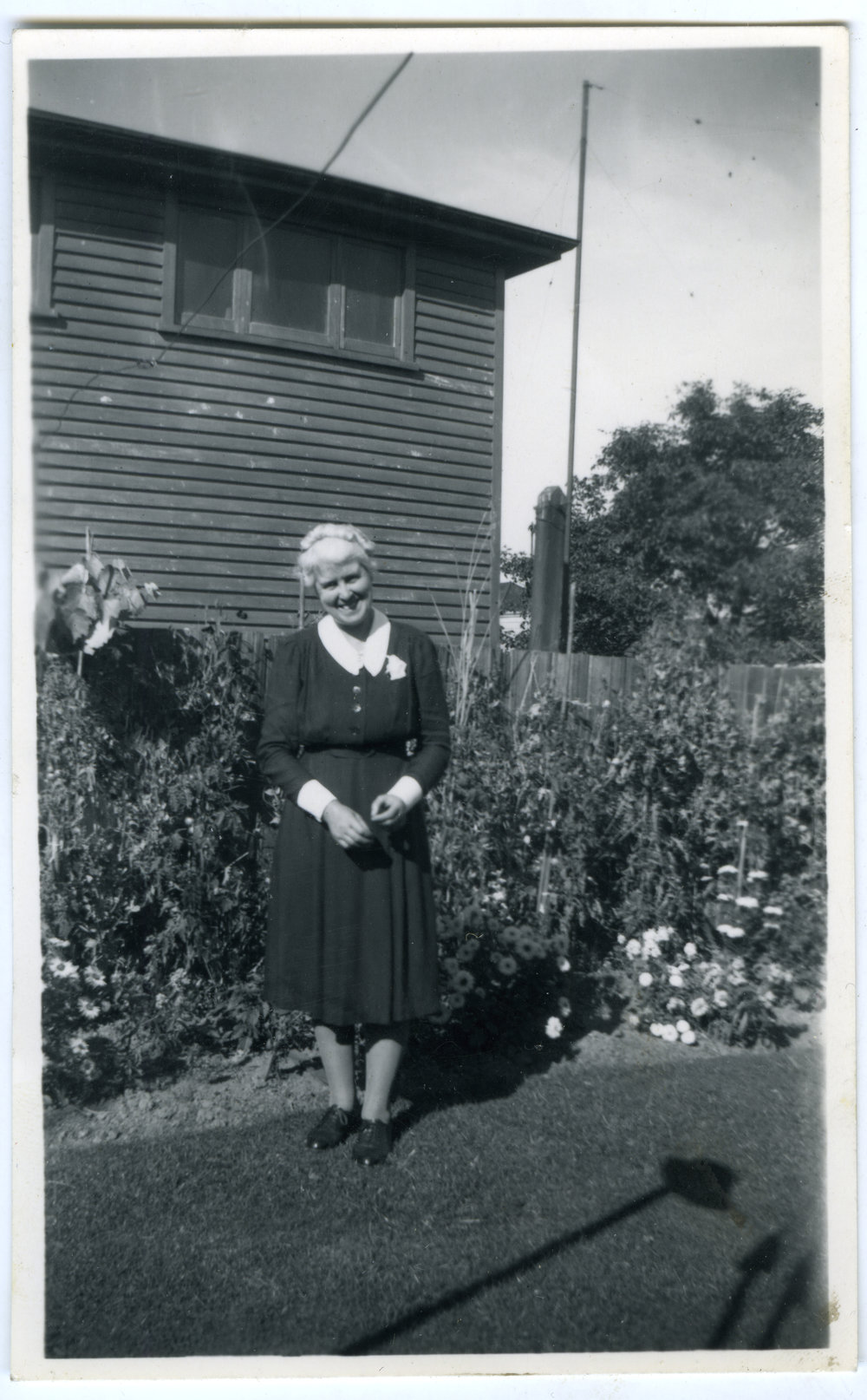 Sister Marion Campbell standing in a garden