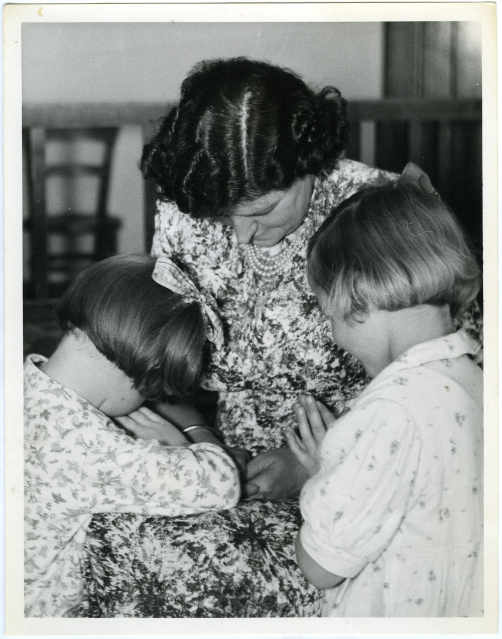 Stephanie Pettit, Miss Halies and Cynthia Mann say their evening prayers, Nesbit Cottage, Glendining Home, 1955