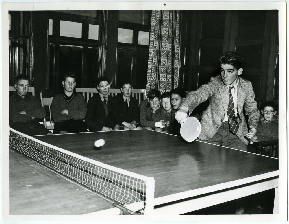 Glendining Home boys watching a game of table tennis, 1958