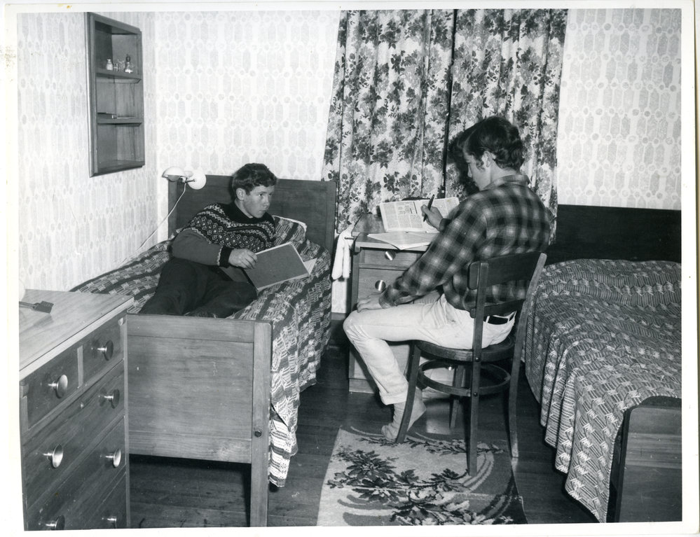 Two unknown boys studying at a Glendining Home Cottage, 1969