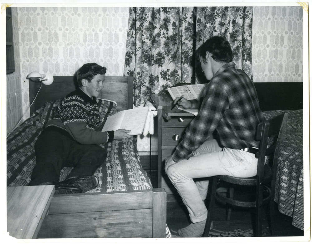 Two unknown boys studying at a Glendining Home Cottage, 1969