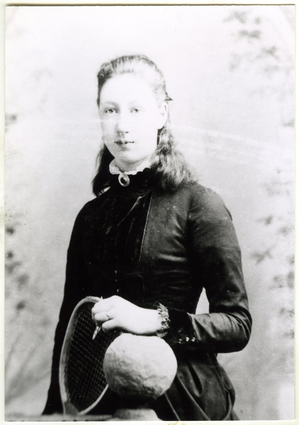 Unidentified woman holding a tennis racquet, portrait 