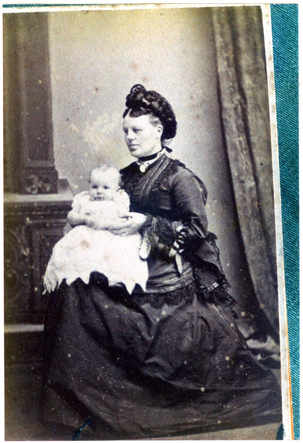 Mary Moore (nee Stewart) holding a baby, portrait