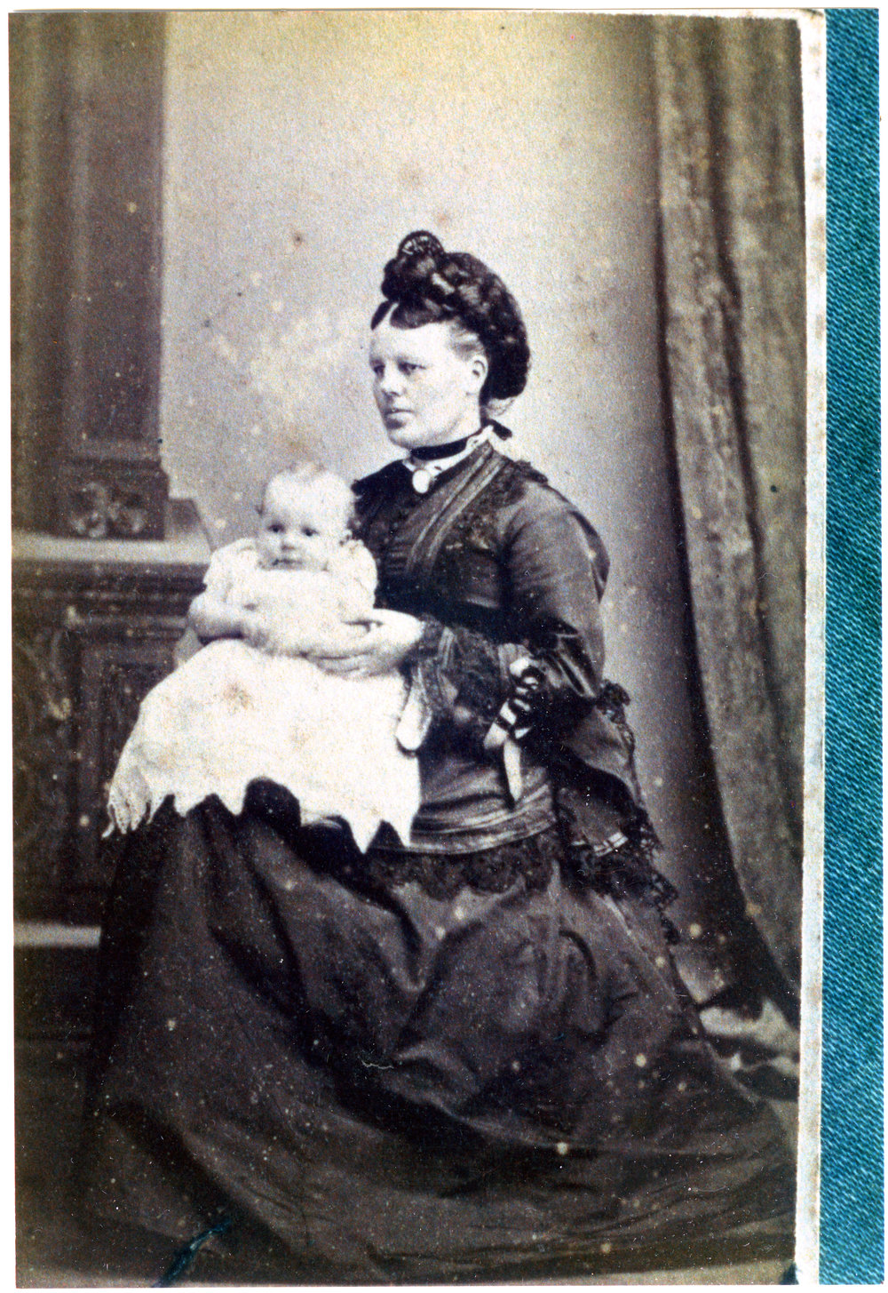 Mary Moore (nee Stewart) holding a baby, portrait