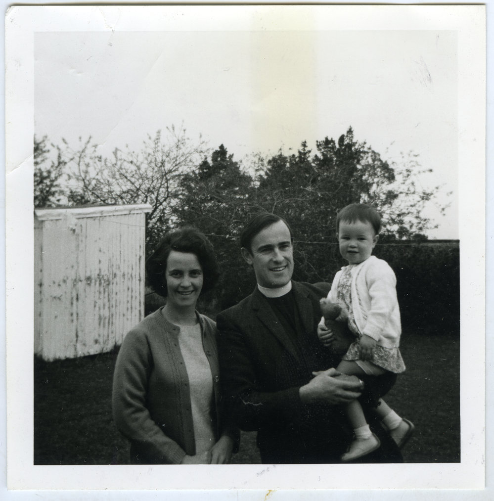 Reverend Simon H. Rae, Mrs. Marion B. Rae holding their child, c. 1971
