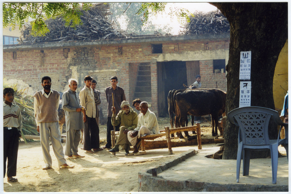 Community health workers gather outside their base in their village