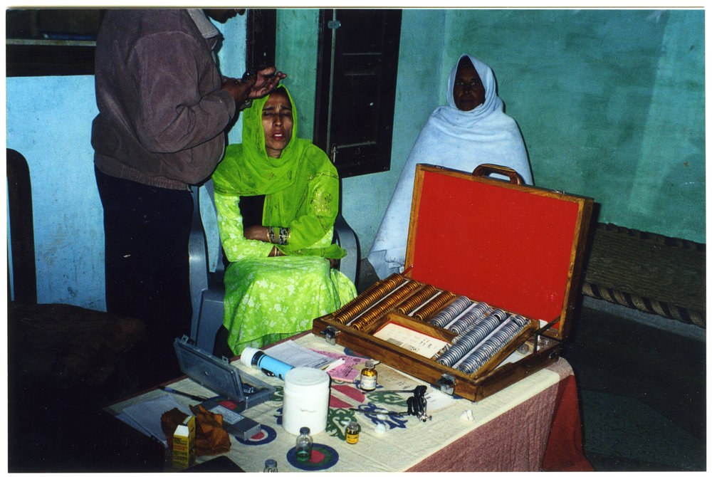 Doctor from the Eye Department examines a patient in the village