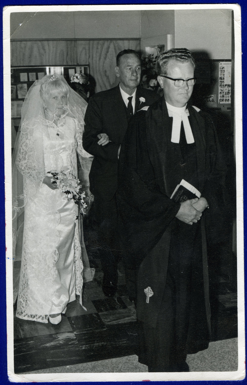 Mary Lauraine Woodcock walking down the aisle with her father, 1966