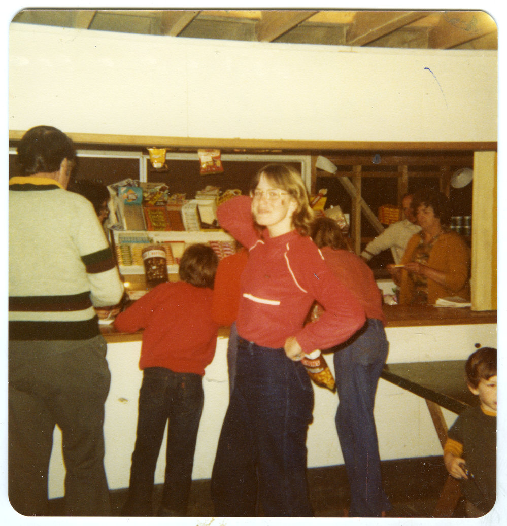 Lynnette Cossill in front of the Tuck Shop