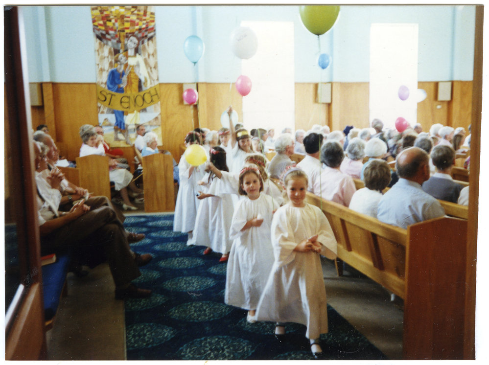 Mellissa Campbell leads the 'angels,' out of St. Enoch's Church, 1990