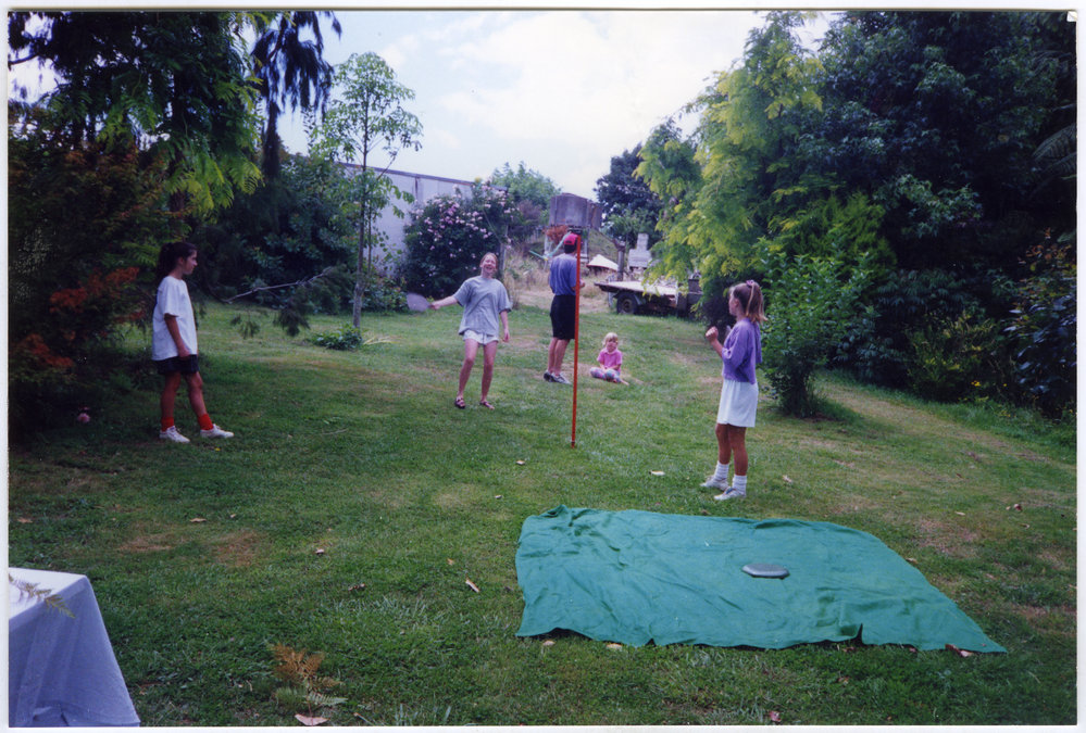 Frances Ede, Gemma Ede and Francis Morton play swingball, John McGovern and Danika McGovern in background, 1992