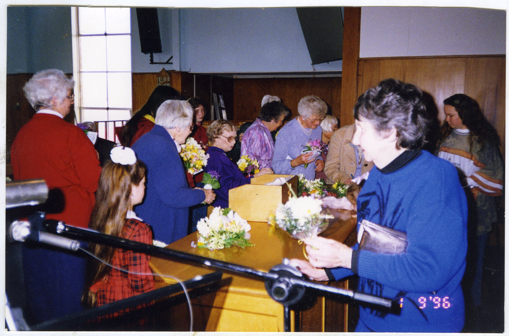 Spring congregation at St. Enoch's Church, flower giving, 1996