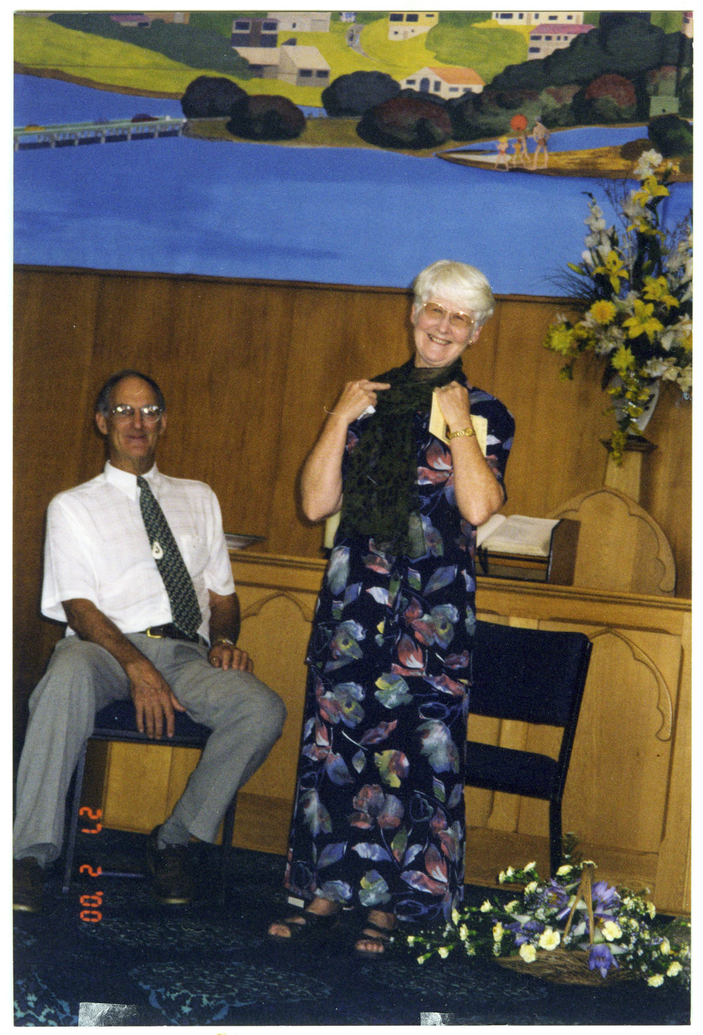 Jill Whimp shows off farewell gifts with Reverend Neal Whimp, 2000