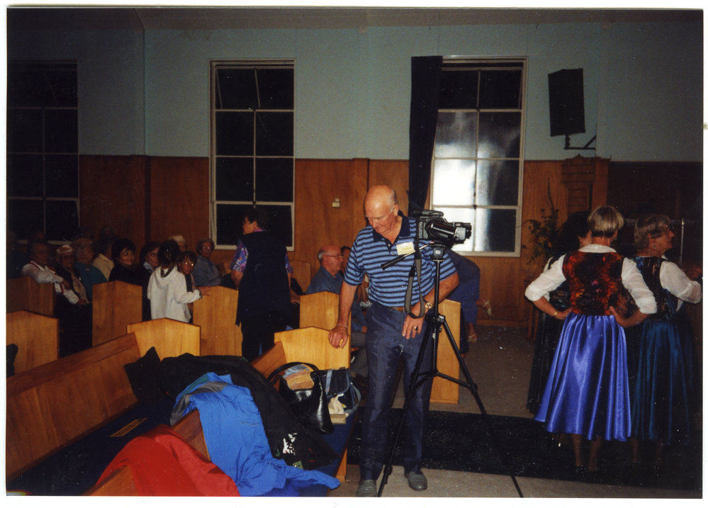 Winton Nicholson filming a concert, St. Enoch's Church
