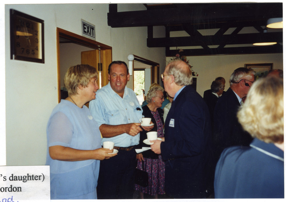 Glenys Hughes and husband speak with Denis Gordon, Beth Elliott in background, St. Enoch's Church