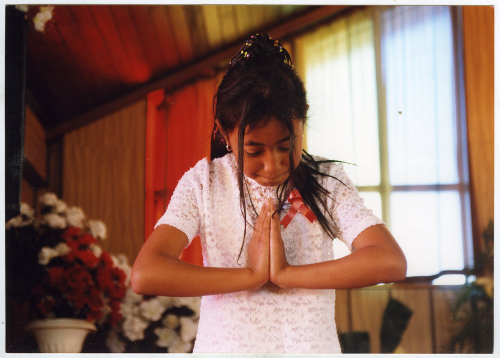 A young girl prays, White Sunday, Glen Eden Pacific Islanders Church, 2002