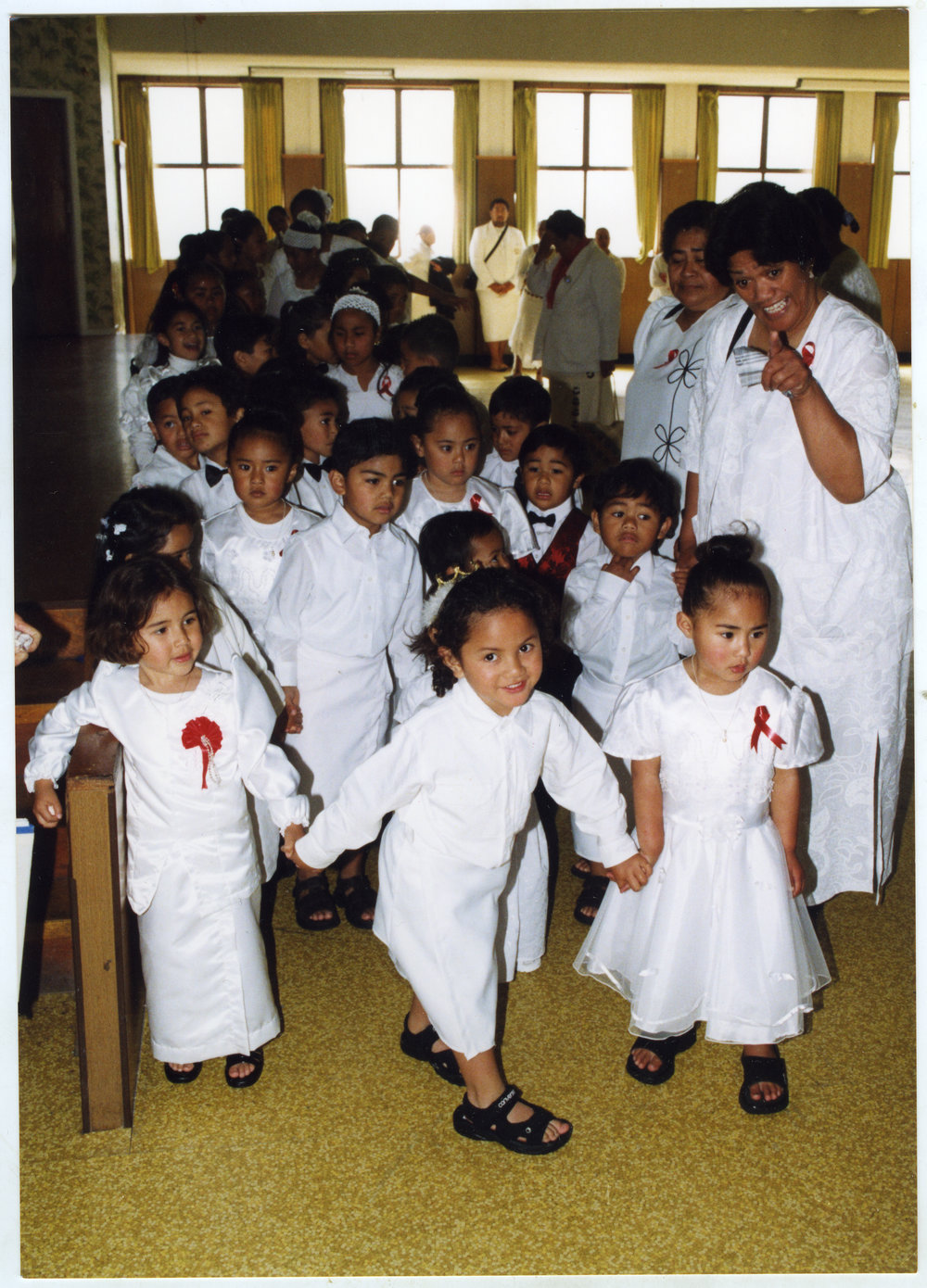 Children and women line up inside Glen Eden Pacific Islanders Church during a White Sunday service, 2002