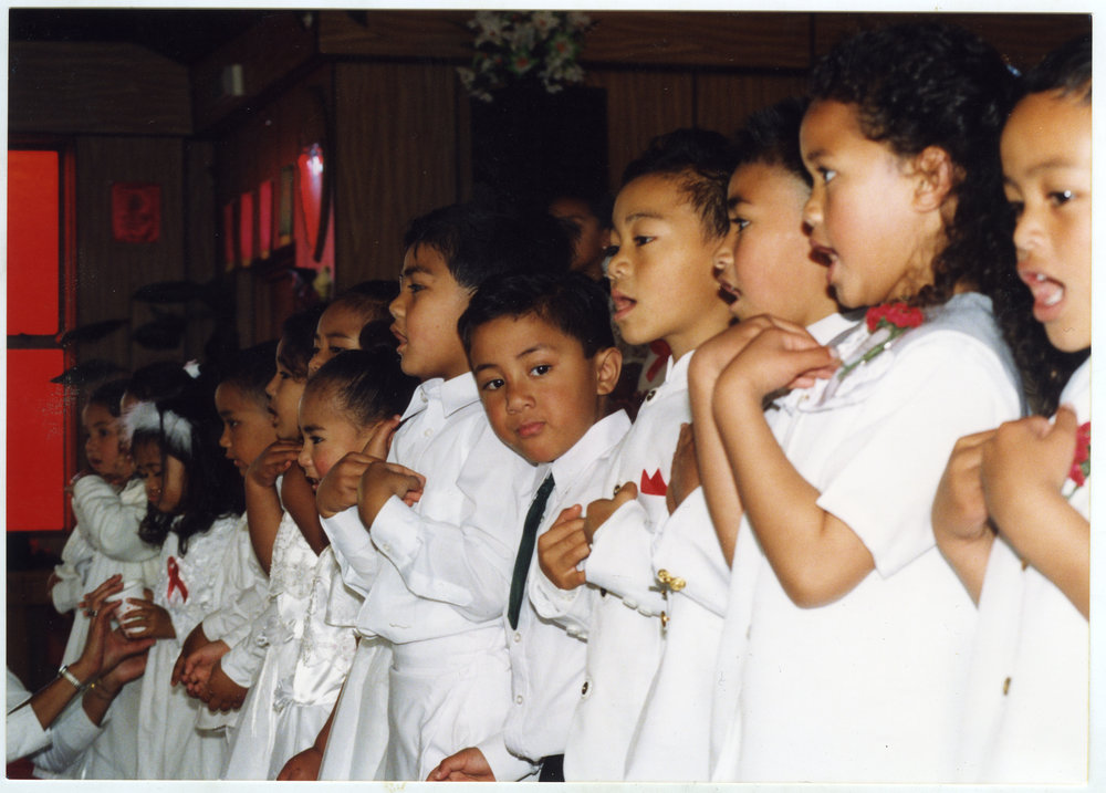 Children sing and dance at the White Sunday service at Glen Eden Pacific Islanders Church, 2002