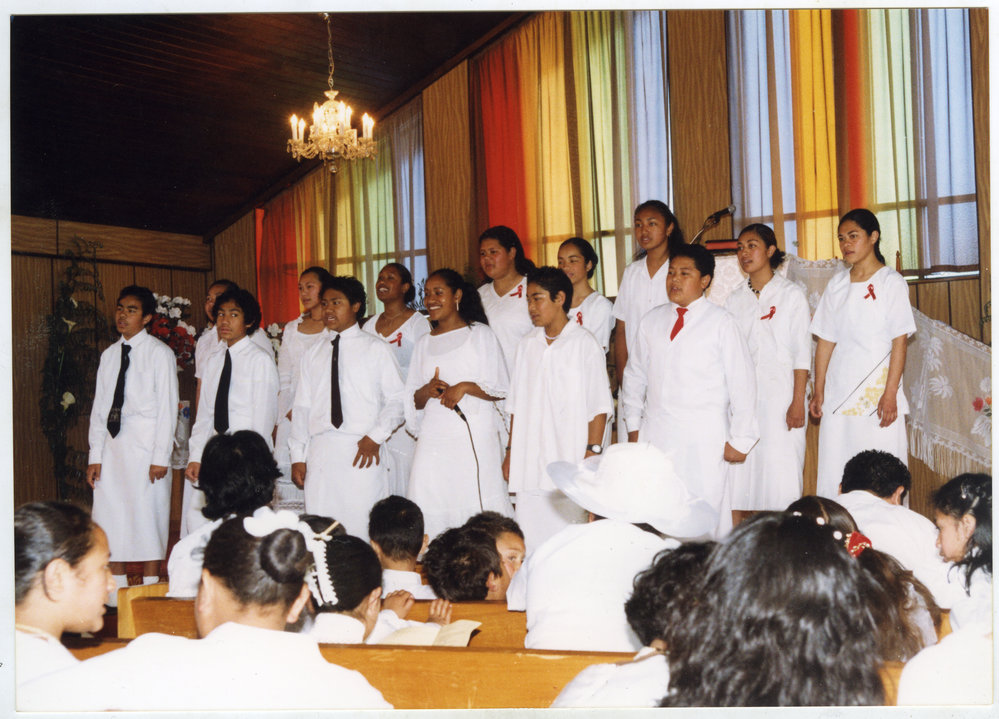Group of young men and women singing at the White Sunday service at Glen Eden Pacific Islanders Church, 2002