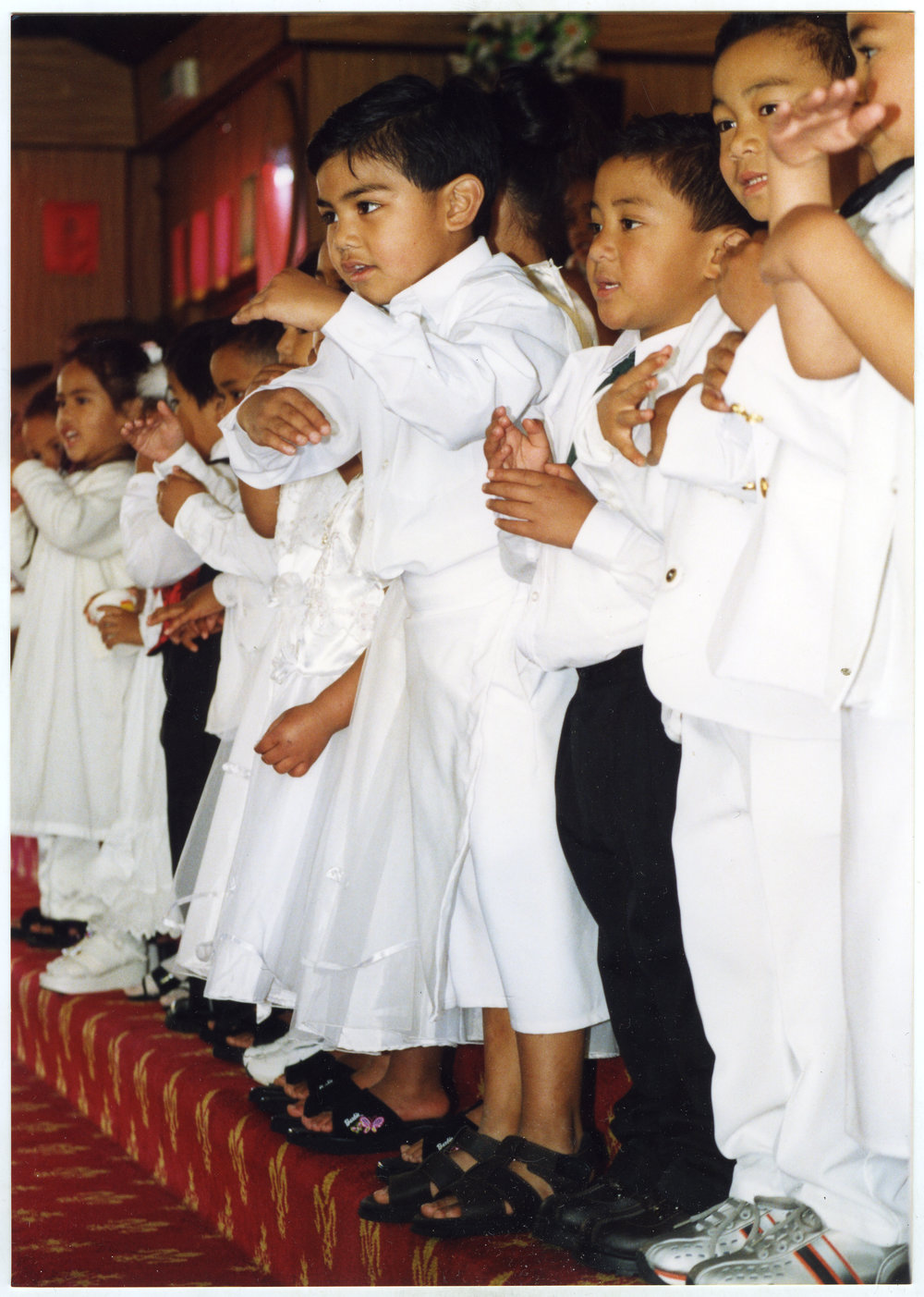 Group of young children perform at Glen Eden Pacific Islanders Church during the White Sunday service, 2002