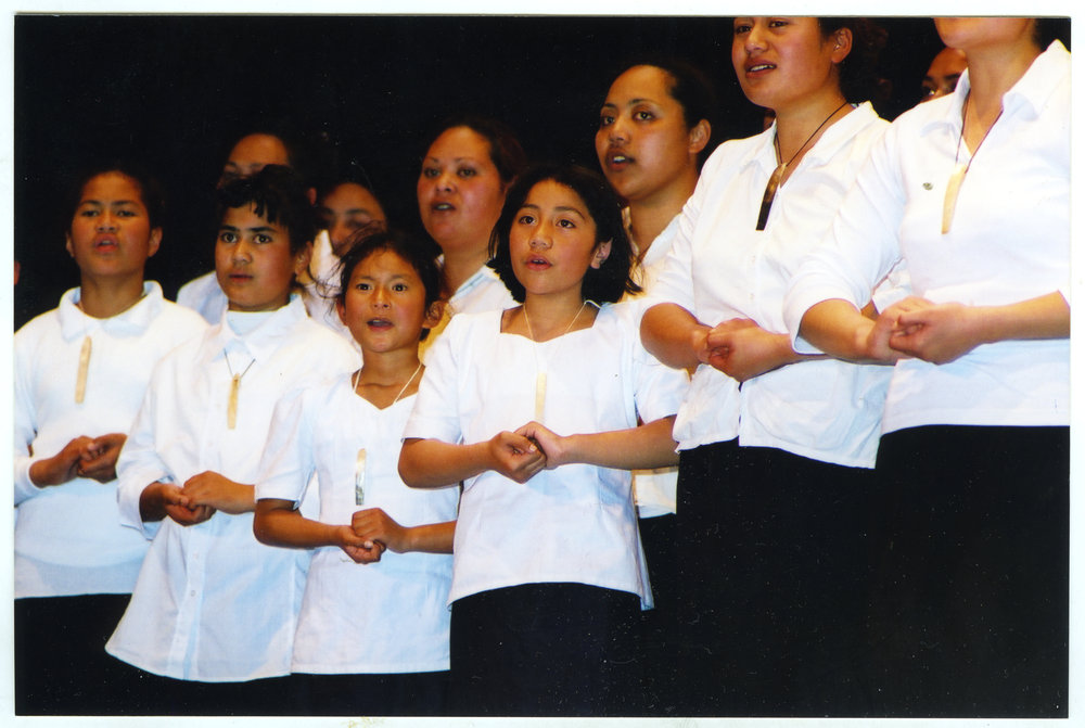 Unidentified group of children and young women singing, General Assembly 2002