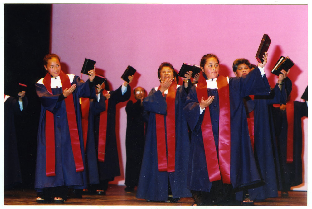 Group of unidentified women in gown and stoles perform on stage, General Assembly 2002