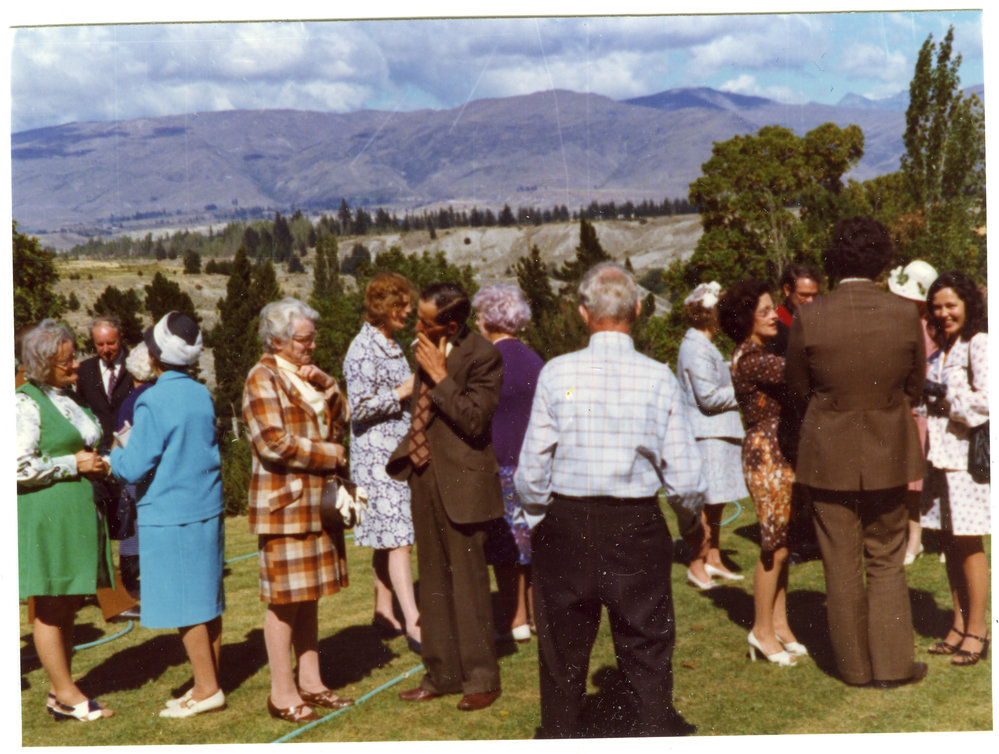 Unidentified adults talk after a service at Cromwell Church