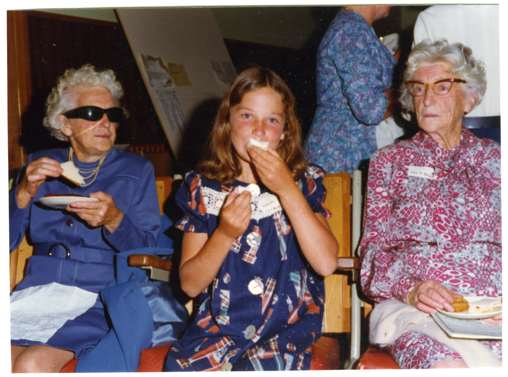 Two women and a young girl eating desserts, Cromwell Church