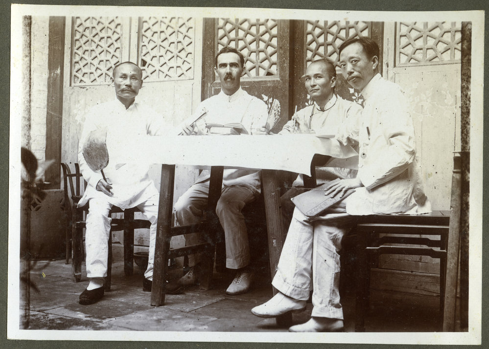 "Working on a Book Of Order," Reverend George Hunter McNeur and three Chinese pastors, 1910