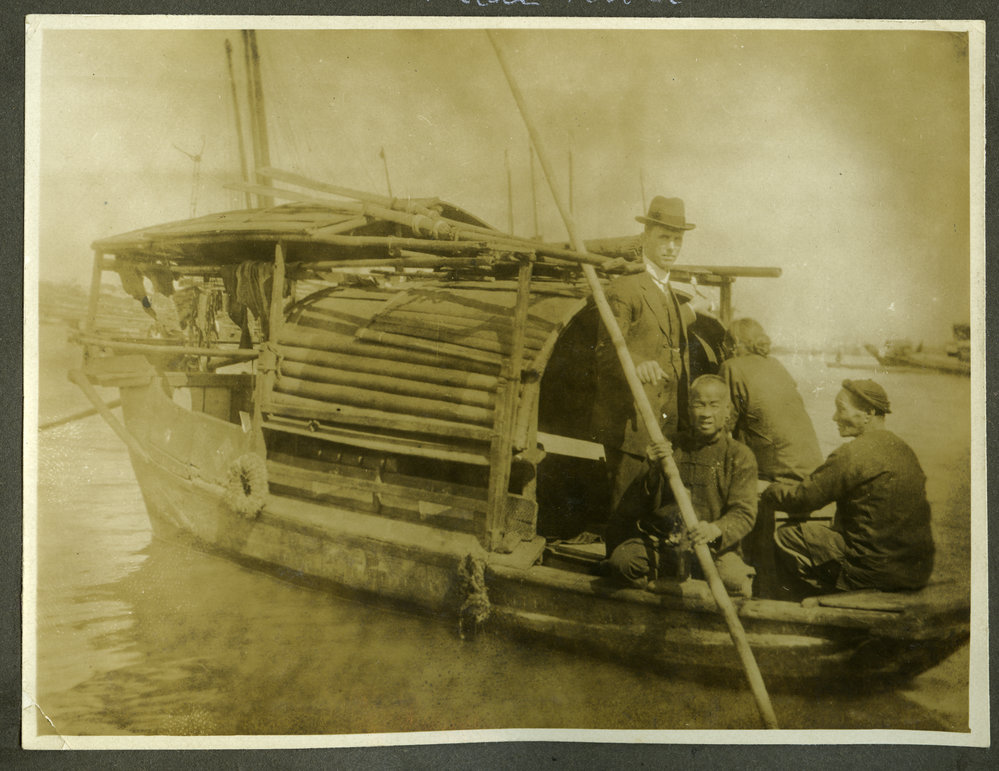 Unidentified European man sailing the Pearl River with three unidentified Chinese men, 1916