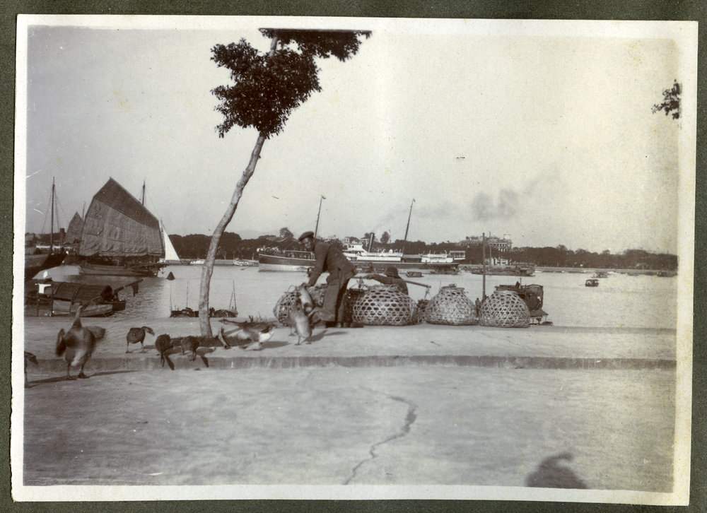 Unidentified man stands next to shipping canal in Canton