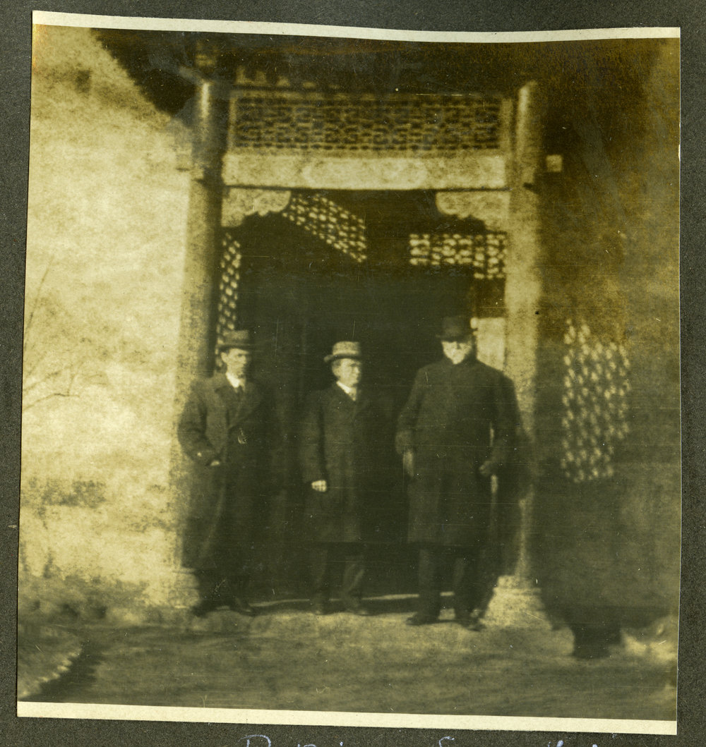 Reverend Professor W. Hewitson at the Pekin Legation with two unidentified men
