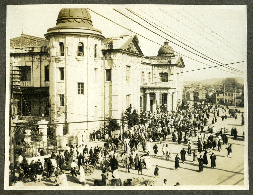 Bank of Korea in Seoul, surrounded by unidentified individuals, Seoul, Korea, 1916