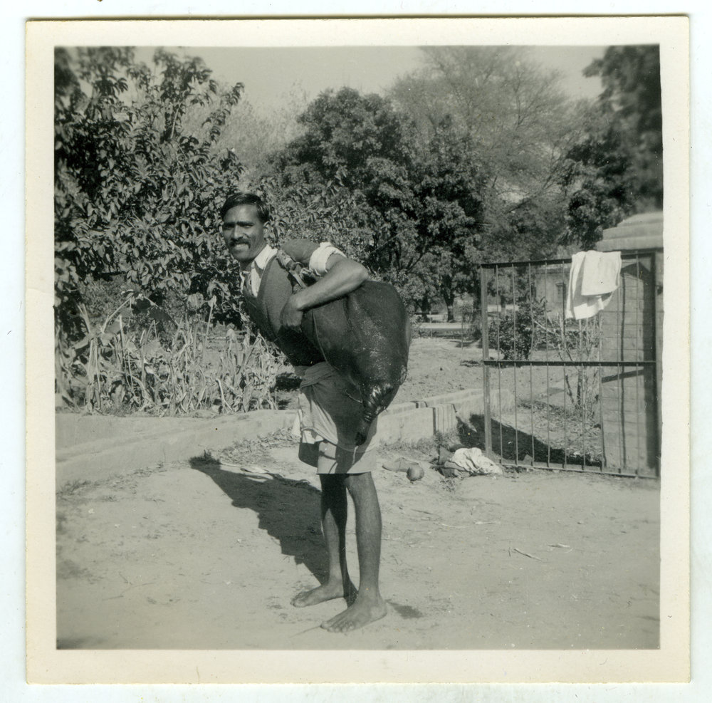 Unidentified man with a skin water bag