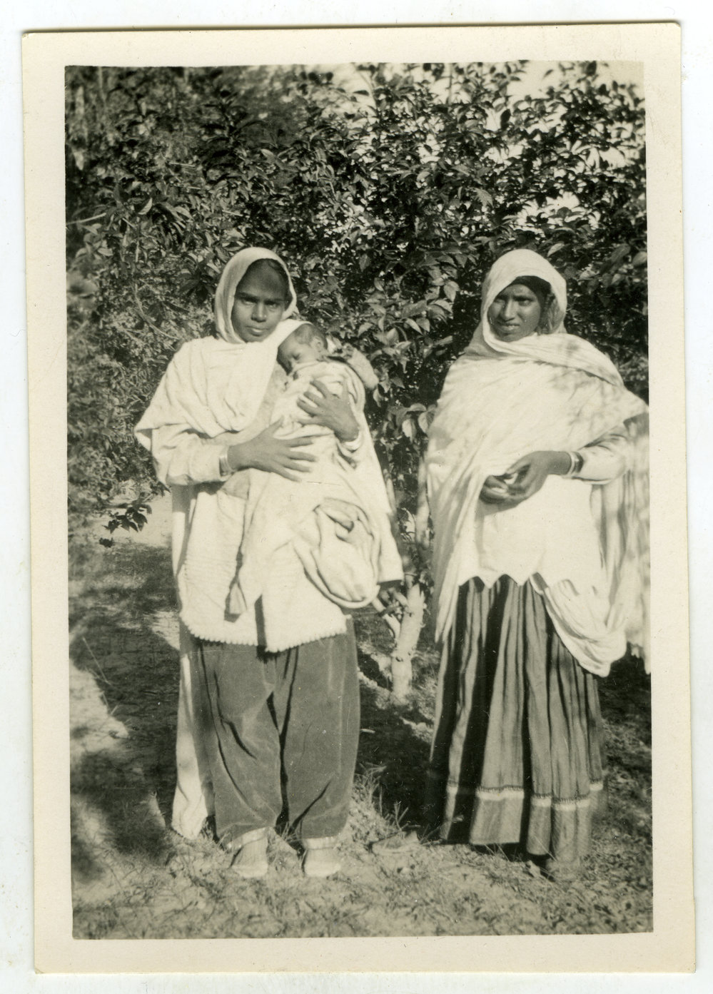 Two unidentified women and a baby