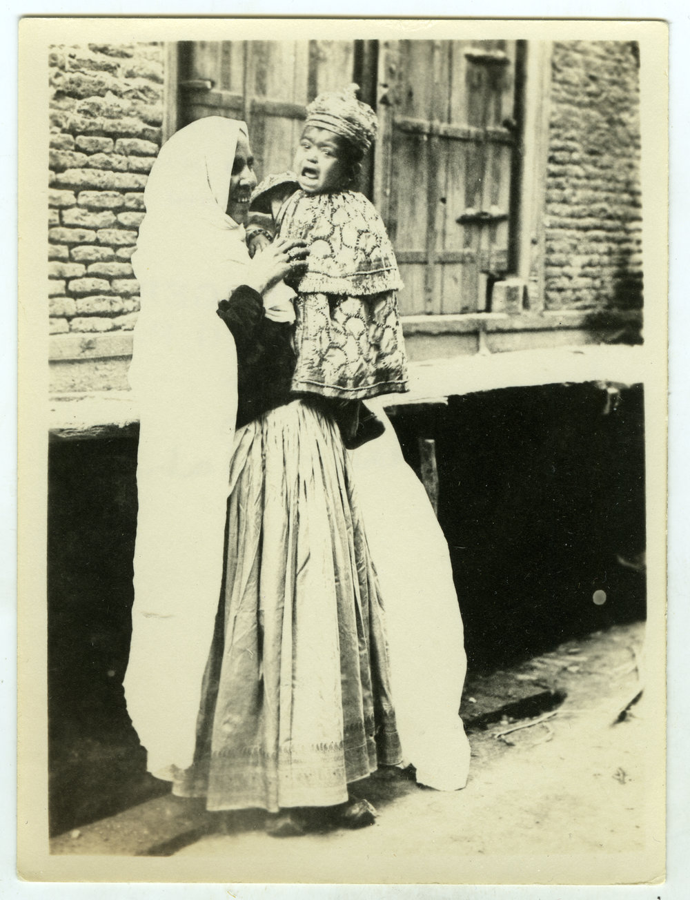 "Showers - Lahou," Unidentified Indian women and her child