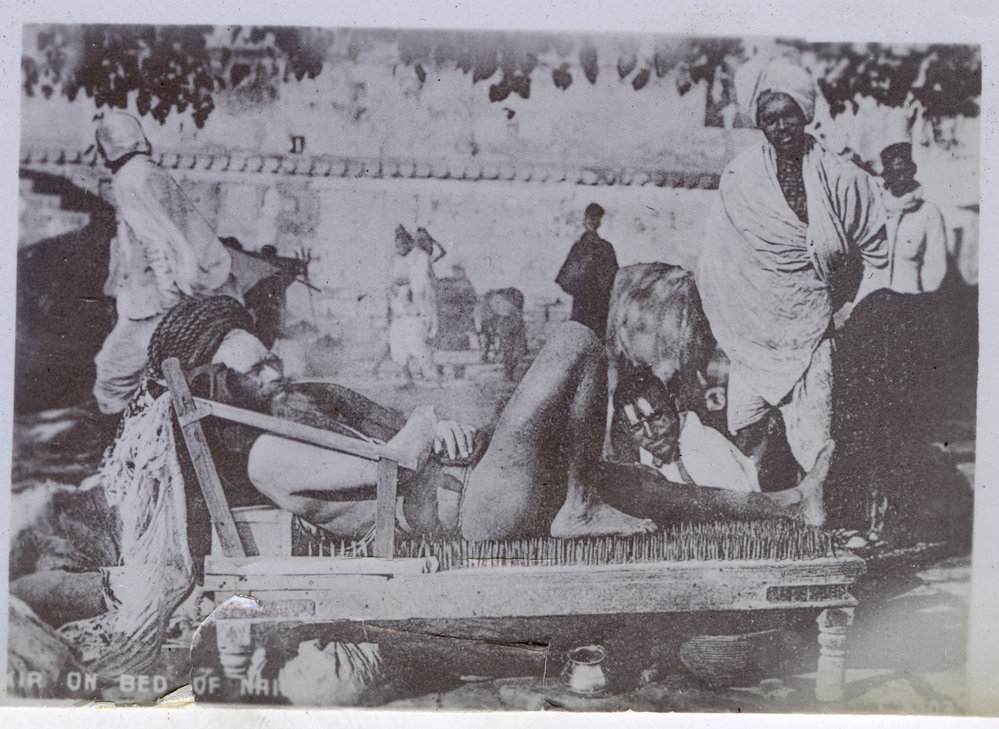 Fakir on a bed of nails